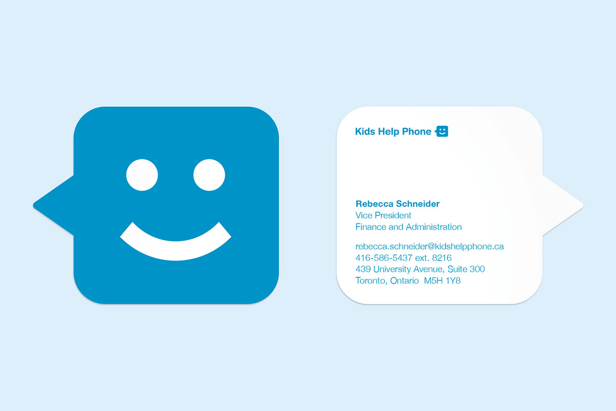 Two sides of a blue die cut business card shaped like a speech bubble with a smiley face on the front and contact info on the back