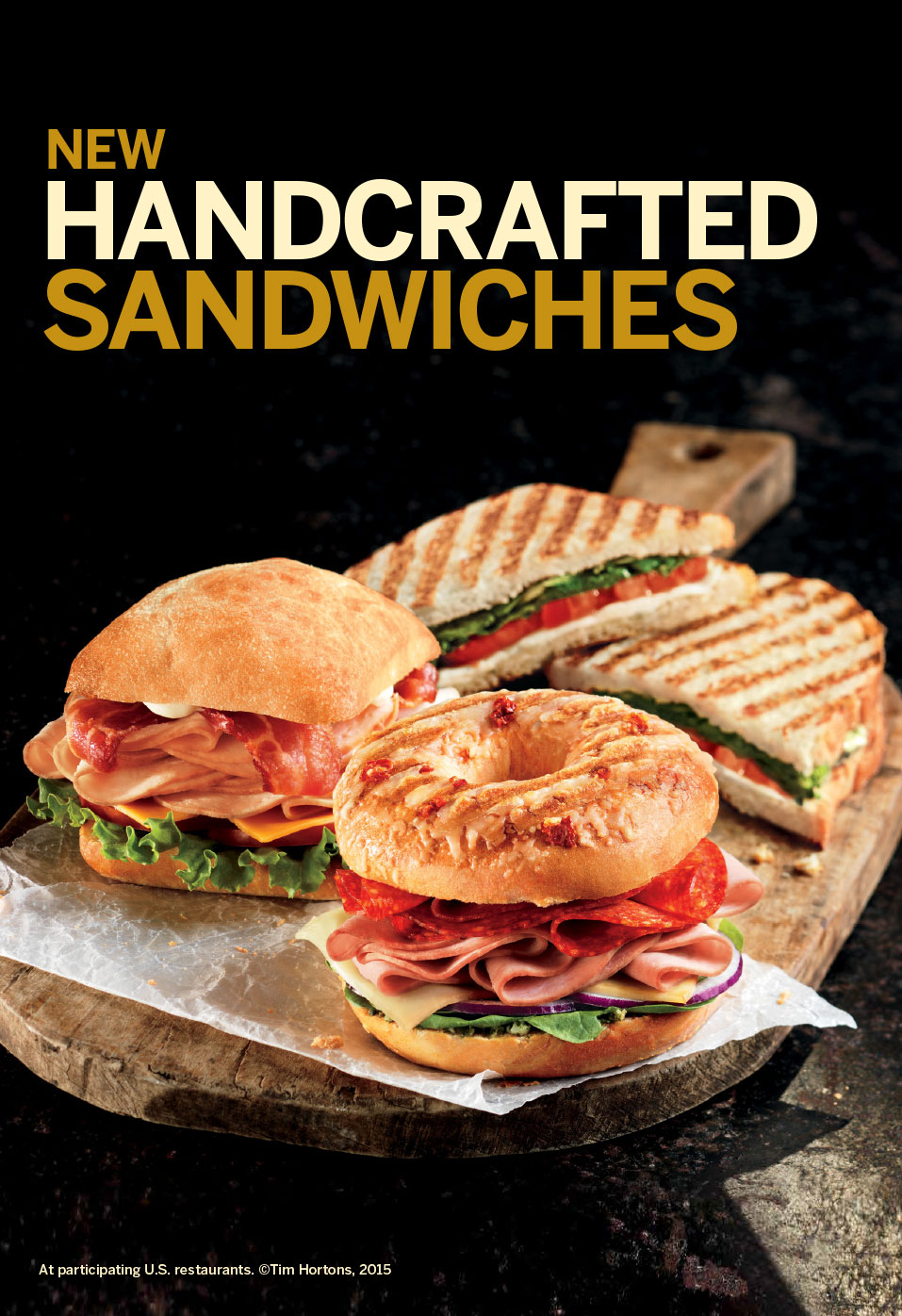 Ad for three Italian sandwiches, with the sandwiches sitting on a cutting board against a dark background